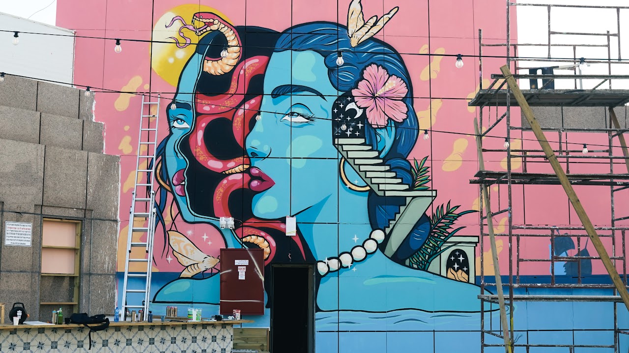Vibrant blue and pink mural at Selina Hotel, Tel Aviv